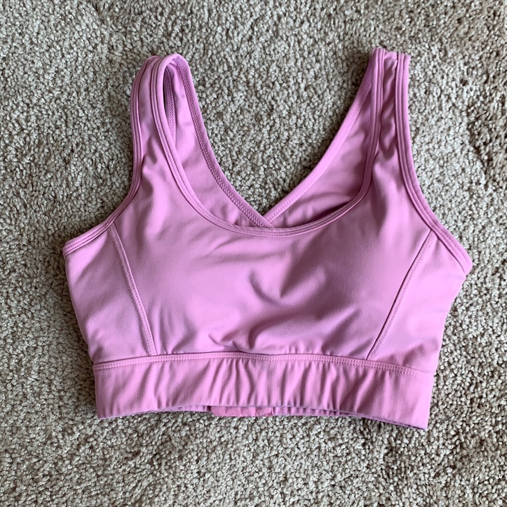 Pink NVGTN sports bra.